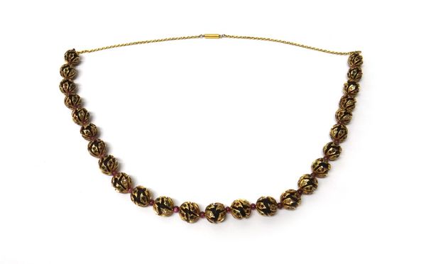 A gold, ambergris and gem set bead necklace, each gem set gold bead enclosing an ambergris bead and with ruby beads at intervals, on an oval link chai