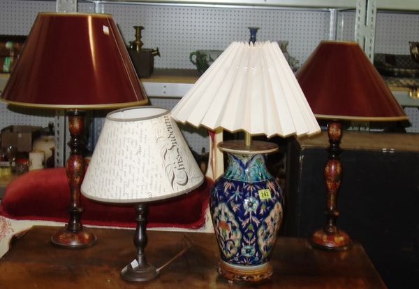 A group of four table lamps including a pair of red painted wooden lamps, a pottery lamp and a metal lamp. DIS