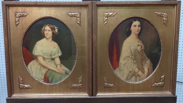 A pair of oleographs of 19th century portraits of ladies, oval, each 26.5cm x 21cm.(2) L1