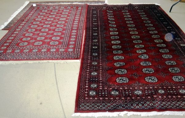 Two Pakistan Bokhara rugs, 251cm x 155cm and 185cm x 128cm (2). J7