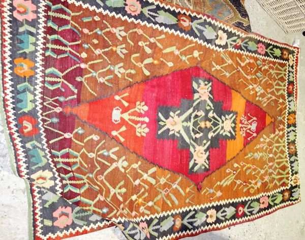 A Bessarabian kelim, the diamond with four noses, madder spandrels with vines, a black and leaf border, 216cm x 135cm and a Chinese tapestry carpet, i