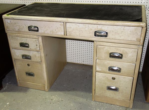 A cream painted 20th century metal pedestal desk with eight drawers about the knee, 121cm wide.  GAL