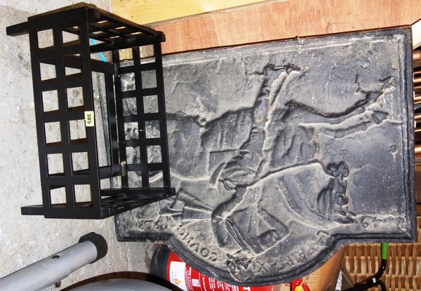 A cast iron fireback with horse and rider decoration together with a modern fire grate. (2) EXTRA