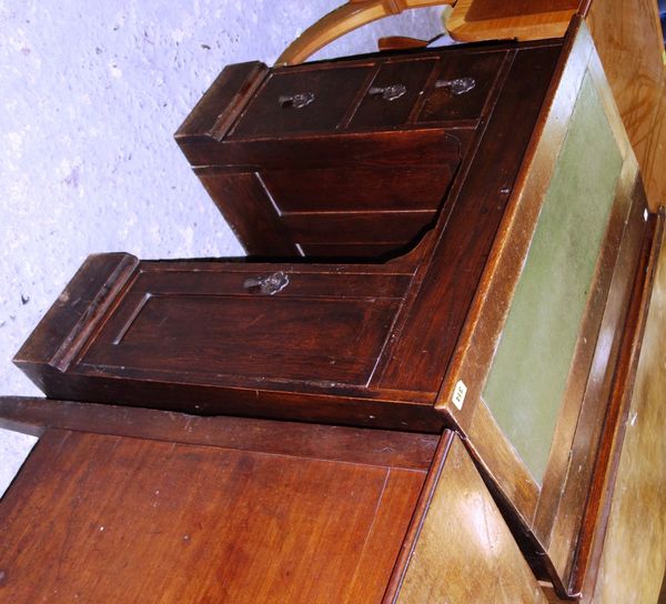 A 19th century oak slope fronted desk with three pedestal drawers and cupboard, 81cm wide. H5