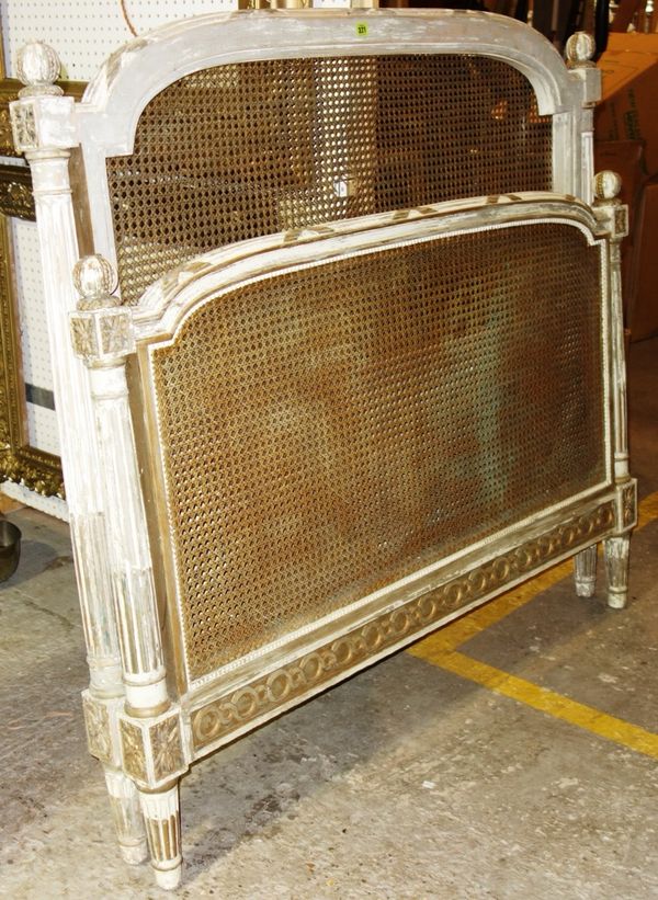 A 19th century white/green painted French double bed with caned panels, overall width 144cm.  K4