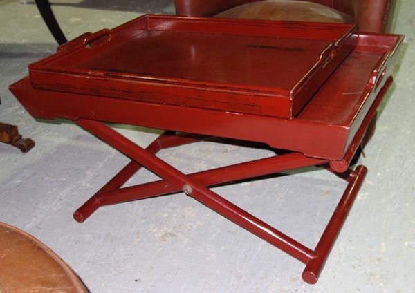 A 20th century red lacquer rectangular tray on folding stand, together with a similar smaller tray (2).  E4