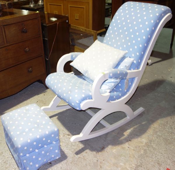 A 20th century white painted rocking chair upholstered with blue spots, together with a matching stool (2).  J5