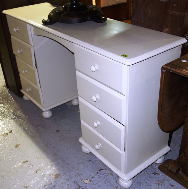 A 20th century  white painted kneehole dressing table, 133cm wide. H2
