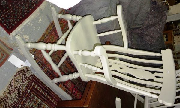 A white painted stick back rocking chair another similar and a white painted scullery armchair. (3) G7