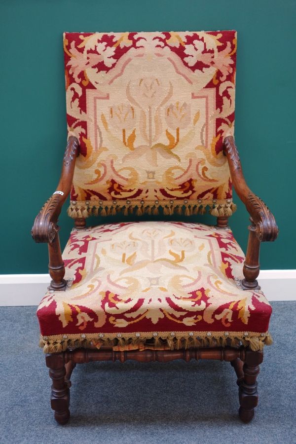 A 19th century walnut framed square back open armchair, on block and turned supports.  J4