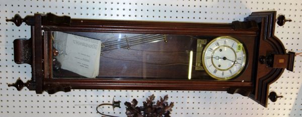 A mahogany cased wall clock.   DIS