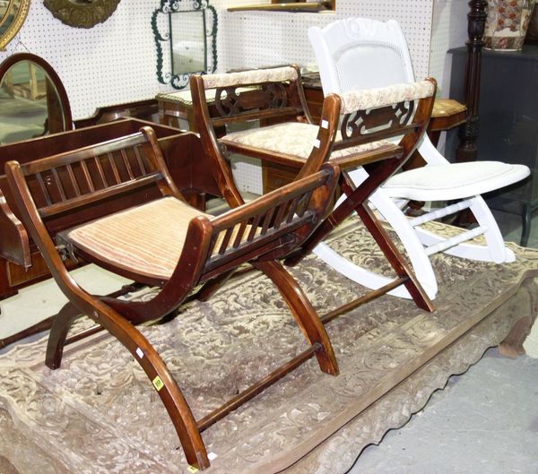 A pair of 20th century walnut folding chairs and a white painted folding chair (3).  B4