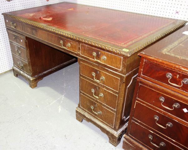 A 20th century mahogany partner's desk with gilt red leather top, 152cm wide. GAL