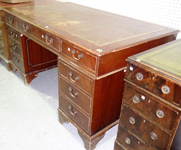A 20th century mahogany partner's desk with burgundy leather top, 150cm wide. GAL