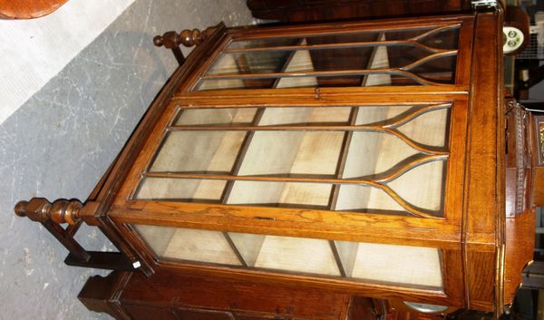A 20th century oak glazed display cabinet, 87cm wide.  DIS