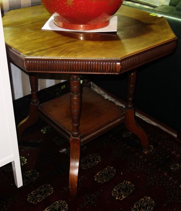 A 19th century walnut octagonal two tier table, 74cm wide.  J7