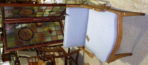 A 19th century and later stripped low armchair and a Aesthetic movement two fold stained glass panel fire screen with bird roundels. (2)  I2