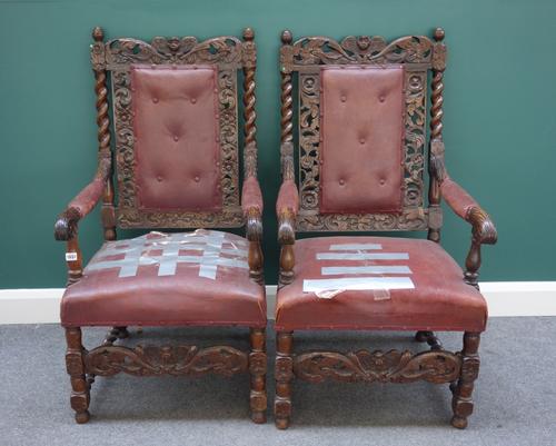 A pair of 19th century walnut framed open armchairs in the 17th century style, on barley twist supports, (2).  K3