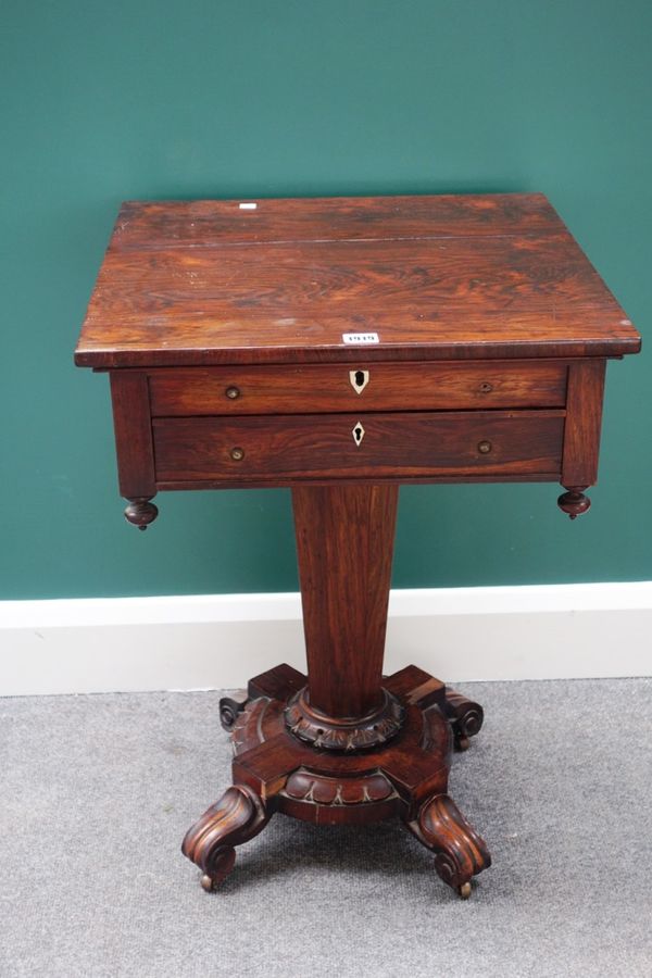 A late William IV rosewood work table, the lift top enclosing a fitted interior over single drawer, on tapering octagonal column and four scroll suppo