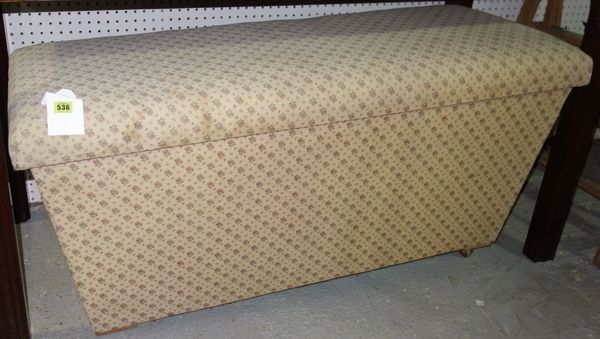 A large 20th century upholstered sarcophagus shaped ottoman. 126cm wide.  A5