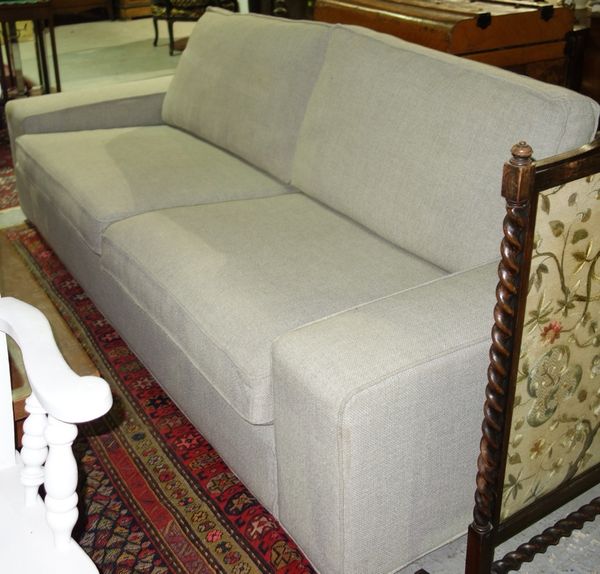 A 20th century cream sofa.  H7
