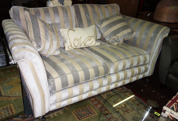 A 20th century cream and silver upholstered sofa, 186cm wide.  J7