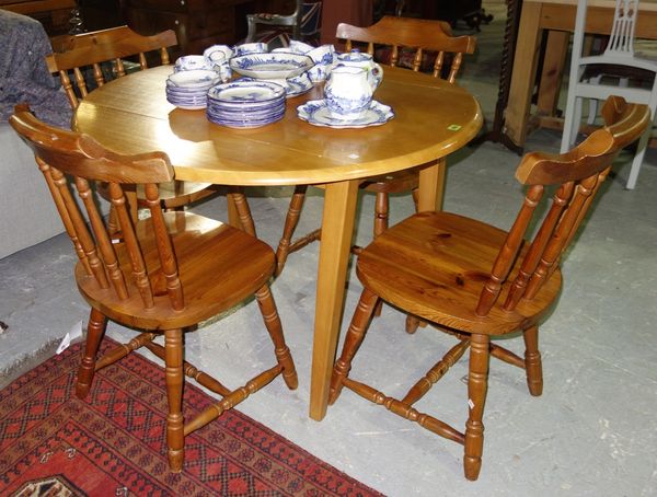 A 20th century beech drop flap table and four chairs, 108cm wide. (5) F6
