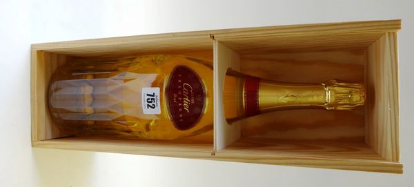 A magnum of Cartier champagne, 100th anniversary edition, in a wooden case