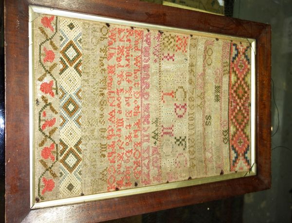 A 19th century framed and glazed needlework sampler in a mahogany frame. CAB