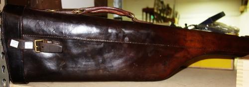 A 19th century leg of mutton leather gun case, together with a set of bowls and a pewter hip flask.  S3T