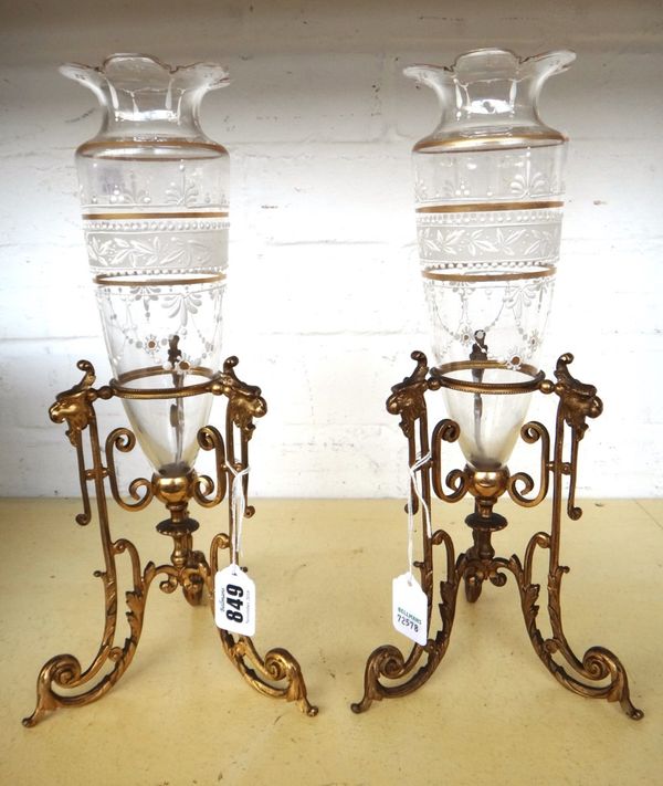 A pair of glass and enamel decorated vases, early 20th century, mounted in gilt metal triform frames, each with lion mask decoration, 20.5cm high, and
