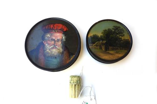 A Stobwasser type circular papier mache lidded box, early 19th century, painted with a bust of a bearded gentleman, 9cm diameter, together with a smal