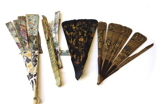 A 19th century Chinese lacquered fan, chinoiserie decorated with a panel of figures, 20cm, together with another Chinese lacquered fan and two early 1