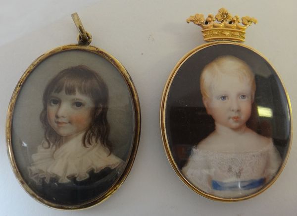 An early 19th century English school portrait miniature on ivory of a child with ornate white neck stock, 4.2cm; and a 19th century portrait miniature
