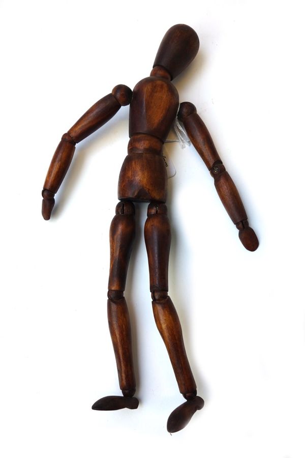 A French stained beech artist's lay figure, 20th century, with articulated joints, 31cm high.