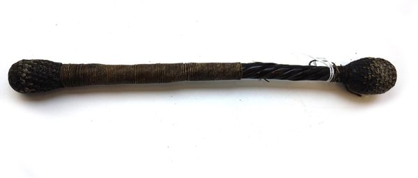 A sailor's priest, 19th century, spiral baleen wrapped in cord, with two weighted bulbous ends, 28cm long.