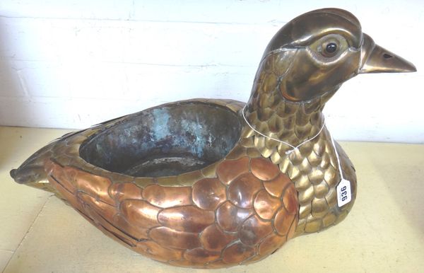A brass and copper duck jardiniere in the manner of Sergio Bustamante, circa 1970, 53.5 cm wide.
