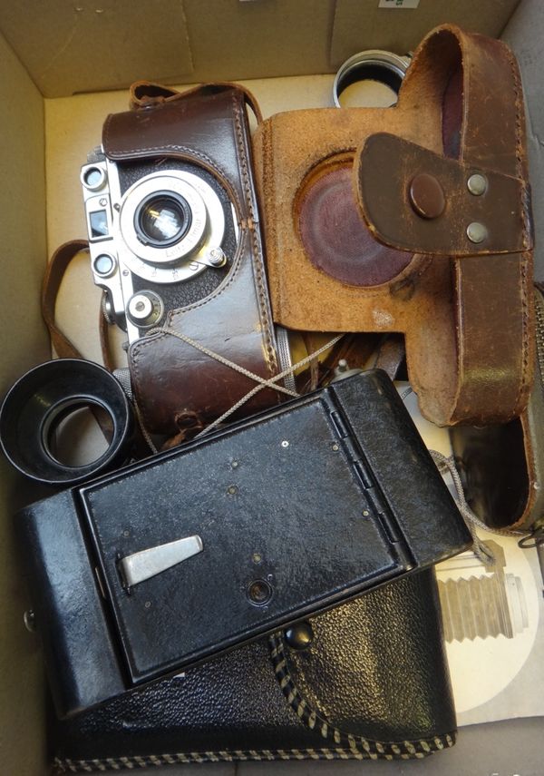 A Leica D.R.P. vintage camera, serial number 339111, cased, with accessories.