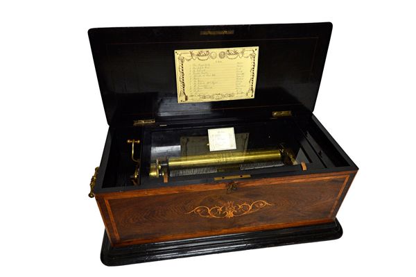 A Swiss rosewood and inlaid music box, late 19th century, the sixteen inch cylinder playing twelve airs, the interior paper label detailed 'Spiraldamp