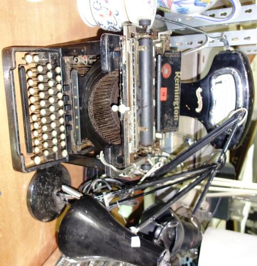 A set of weighing scales, a Remington typewriter and three desk lamps, (5). DIS