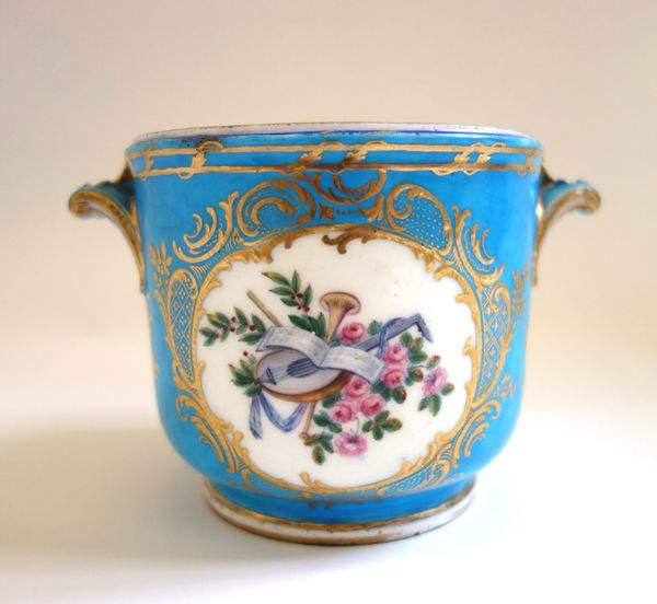A Sevres bleu celeste ground two-handled glass cooler, the porcelain 18th century,  later painted with a family group within a gilt foliate cartouche