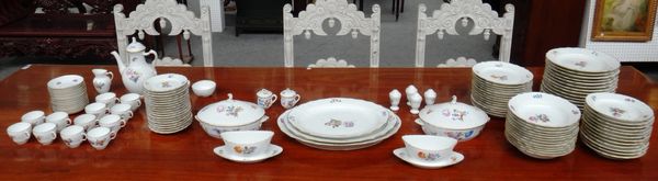 A Royal Copenhagen dinner and tea service decorated with floral sprays against a white gilt ground with a wide basket weave border. (qty)