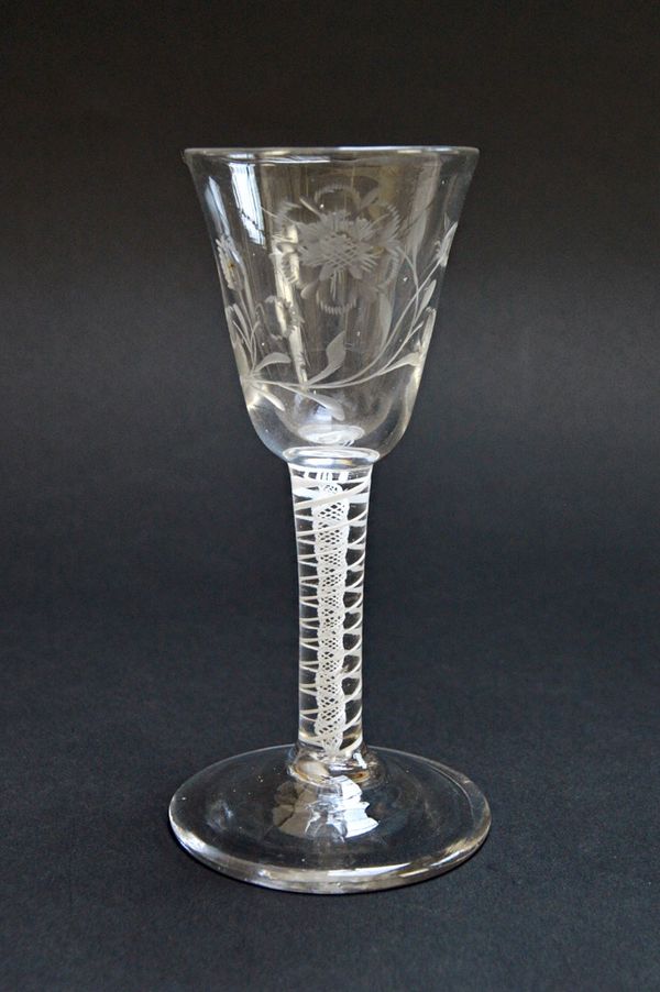 An engraved Jacobite type wine glass, circa 1765, with rounded funnel bowl, engraved (possibly later) with a bird and flowers over a double series opa