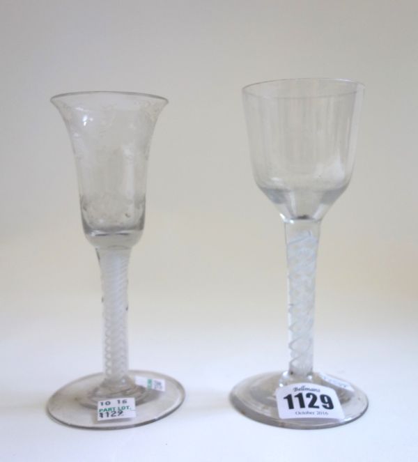An 18th century wine glass, circa 1765, with ogee bowl and double series opaque twist stem, 16cm high, and a 19th century engraved wine glass with bel