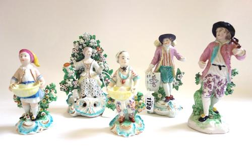 A group of five Derby figures, circa 1770-90, comprising; a map seller raised on a scroll moulded base; a figure of a vintner carrying a barrel over o