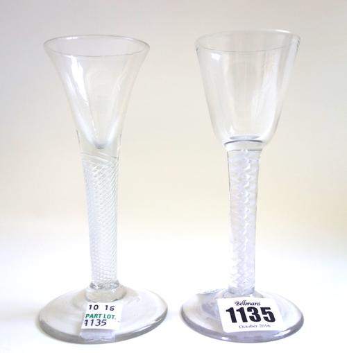 An 18th century wine glass, circa 1765, with rounded funnel bowl and double series opaque twist stem, 14.5cm high, and another mid 18th century wine g