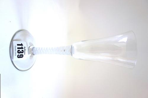 An 18th century wine glass, circa 1765, with rounded funnel bowl and single series opaque twist stem, 17.5cm high.