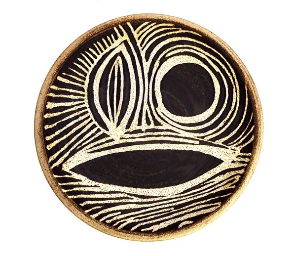 A Hans Coper (British, 1920-1981) glazed stoneware dish with abstract design, circa 1953, with impressed marks, 36.5cm diameter. Illustrated