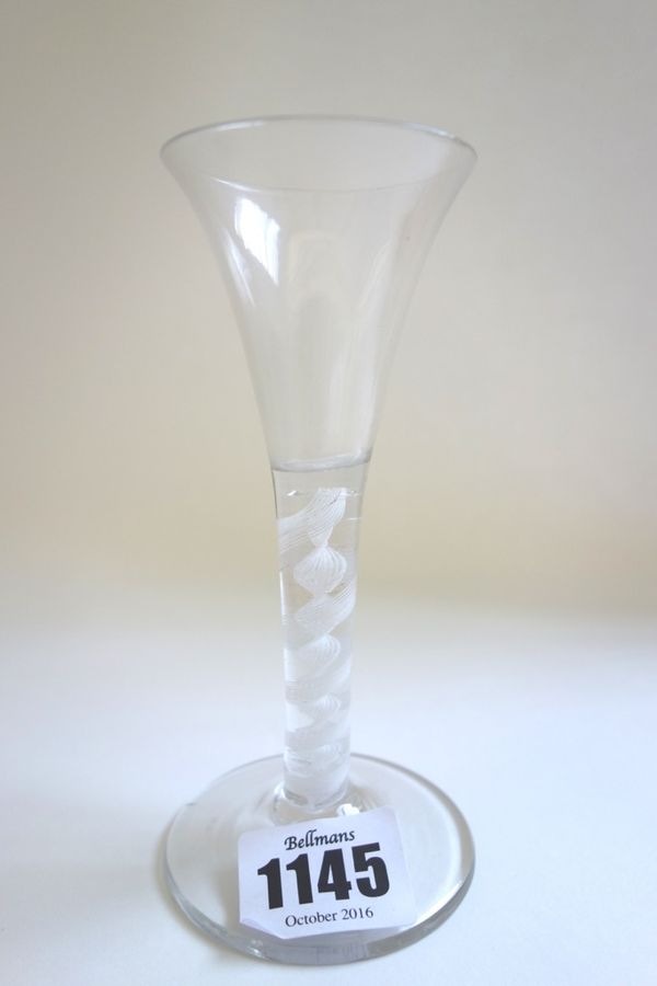 An 18th century wine glass, circa 1765, with drawn trumpet bowl and double series opaque twist stem, 13.5cm high.