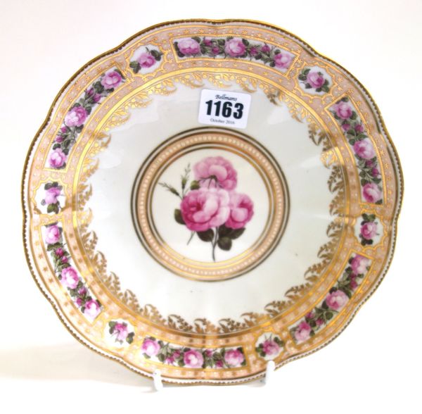 A Derby lobed circular dish, circa 1787-90, pattern 129, painted with pink roses reserved on a salmon pink border, gilt with stars and white enamel do